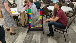 David Rasidlo watches the family play his game.